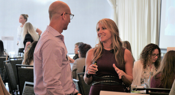 Amy Vetter talks with Kyle Bickhart PHOTO: Amy Vetter, CPA, CGMA, CITP, talks with OSCPA CFO Kyle Bickhart, CPA, at the June 27 Women, Wealth & Wellness Conference in Columbus.