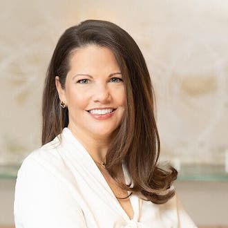 Woman smiling for camera.