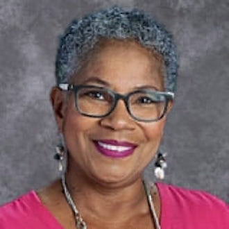 Woman smiling for camera.