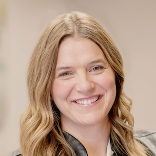 Woman smiling for camera.