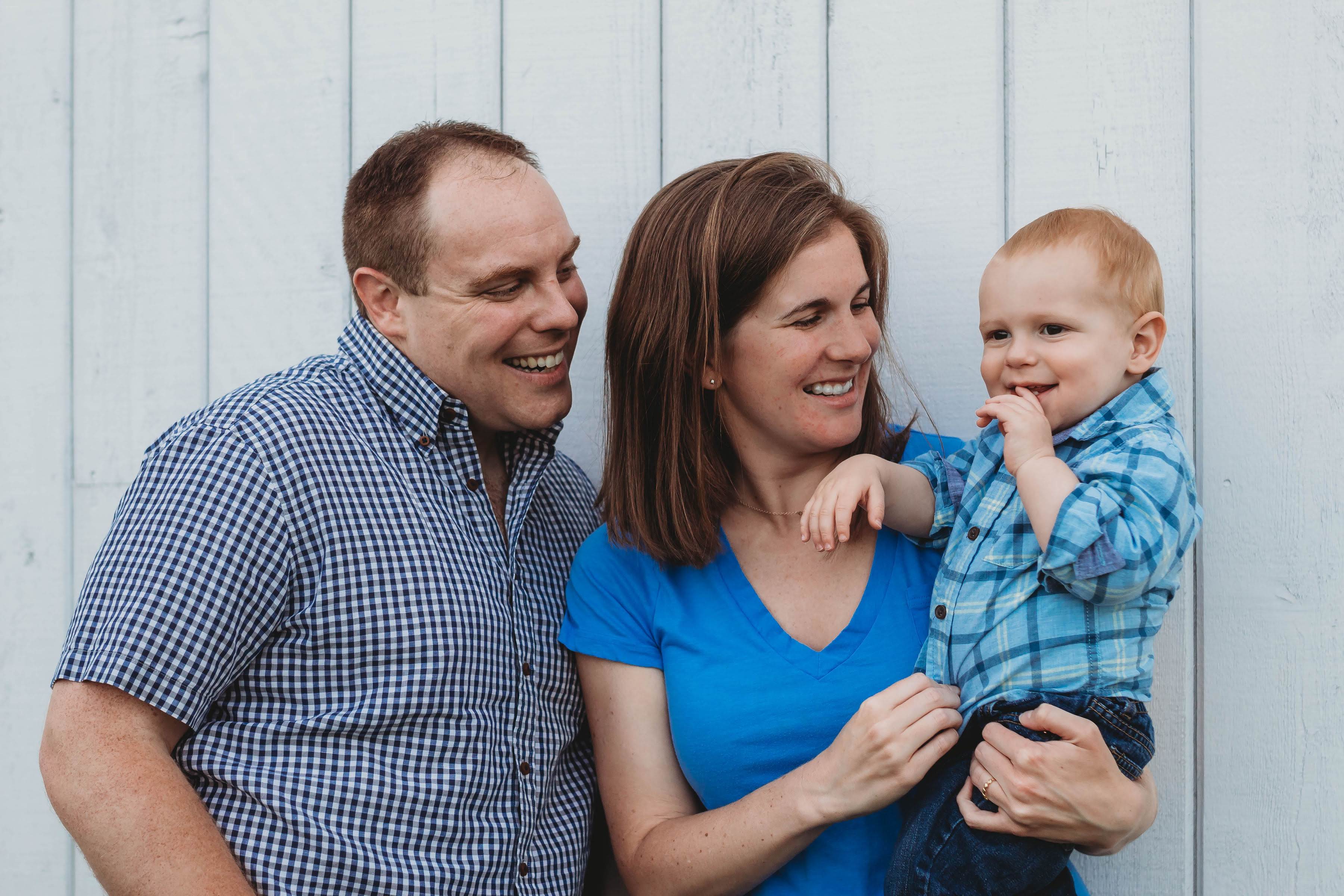 Mom and dad holding one-year-old son.